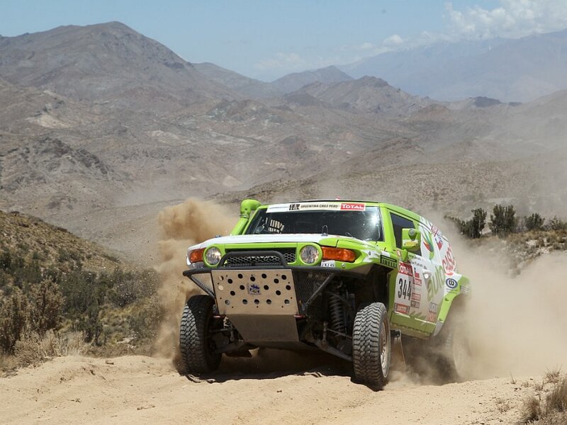 Rally Car on Dirt Road — Green, Dynamic, Afternoon, Photograph, Dust