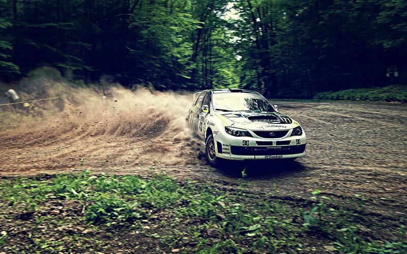 Rally Car on Dirt Road — Green, Dynamic, Afternoon, Photograph, Trees, Dust, Brown, White