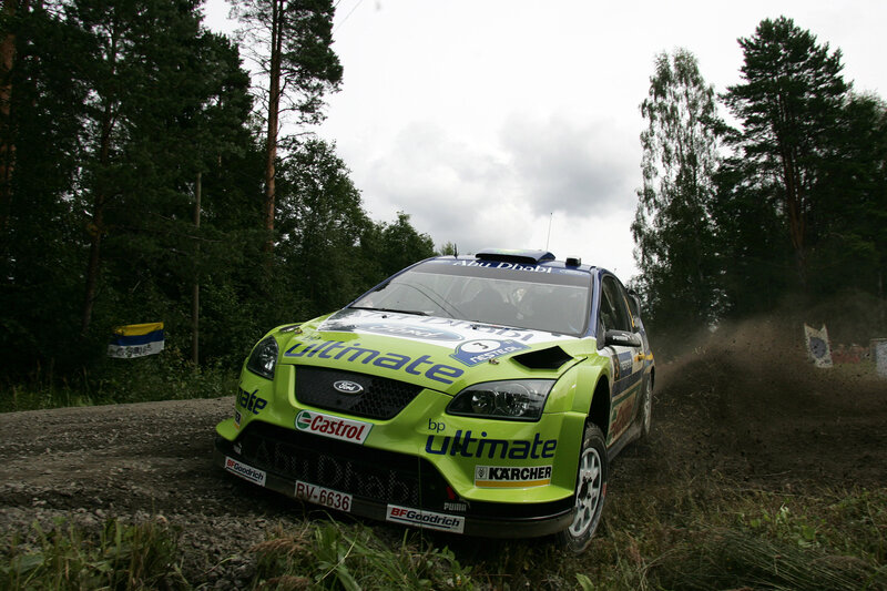Rally Car on Dirt Road — Green, Dynamic, Afternoon, Photograph, Trees, Mud