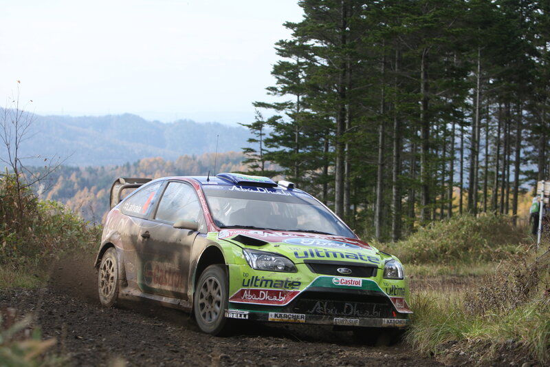 Rally Car on Dirt Road — Green, Dynamic, Autumn