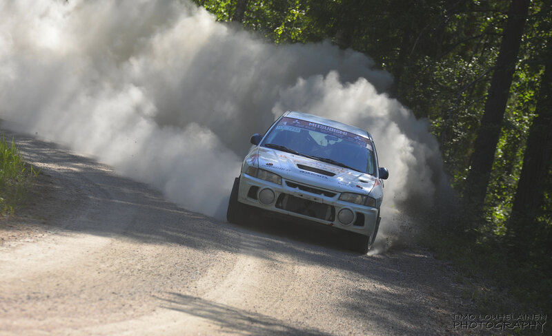 Rally Car on Dirt Road — White, Dynamic, Afternoon, Photograph, Dirt Road, Trees, Dust Cloud