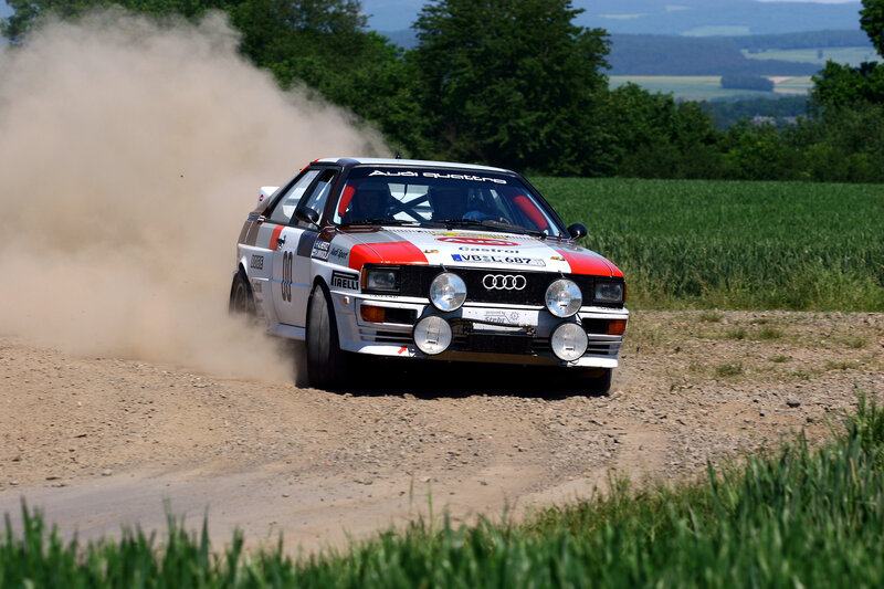 Rally Car on Dirt Road — White, Dynamic, Afternoon, Photograph, Dust Cloud, Field