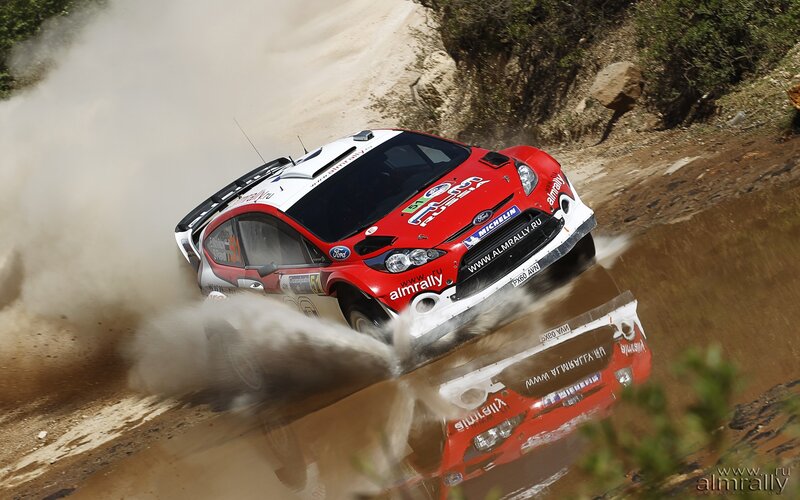 Rally car on dirt track