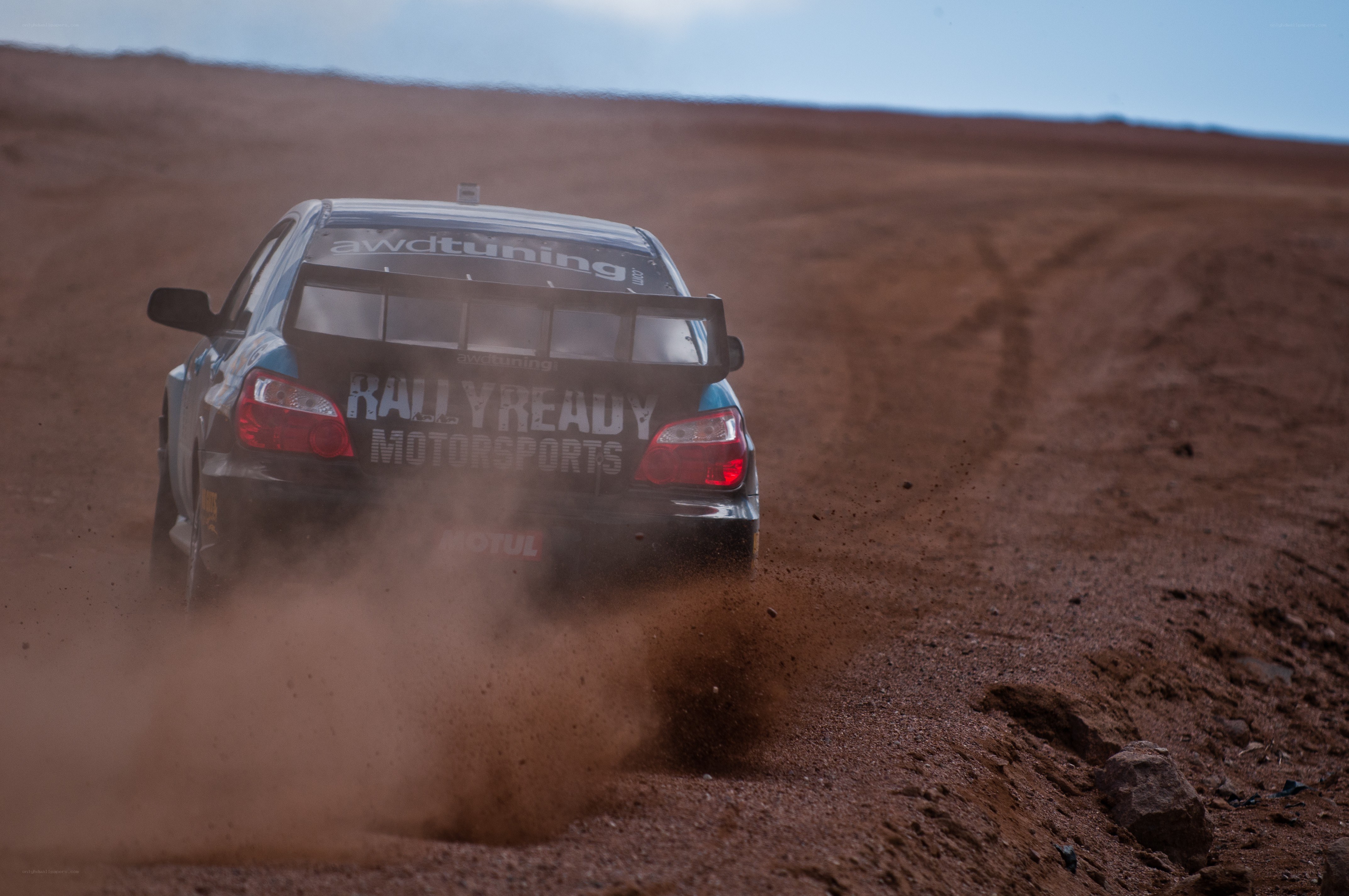 Rally car on dirt track