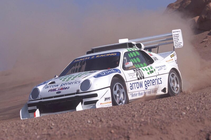 Rally Car on Dirt — White, Dynamic, Afternoon, Photograph, Dust, Rock