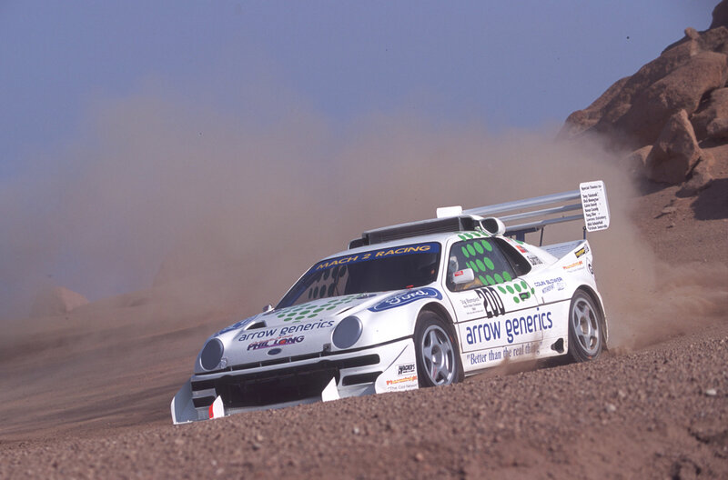 Rally Car on Dirt — White, Dynamic, Afternoon, Photograph, Dust, Rocky Hill
