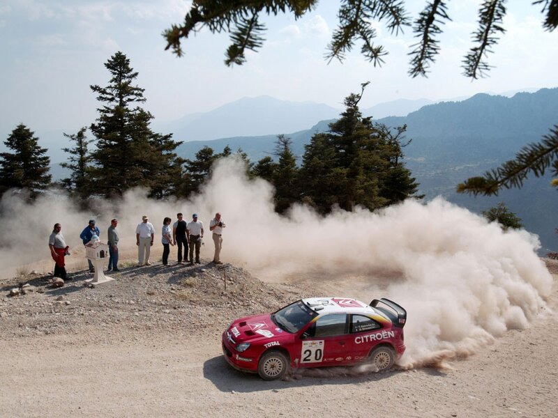 Rally car on dusty mountain road