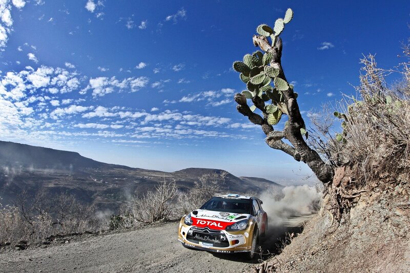 Rally car on dusty mountain road