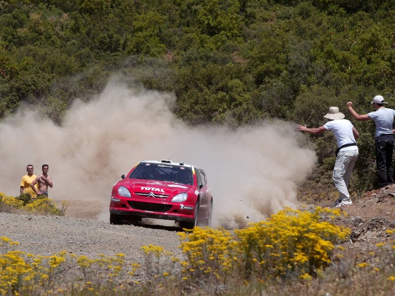 Rally car on dusty road