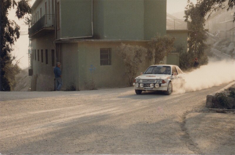 Rally car on dusty road