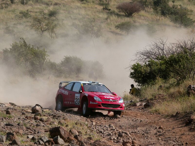 Rally car on dusty terrain