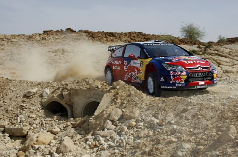 Rally car on dusty terrain