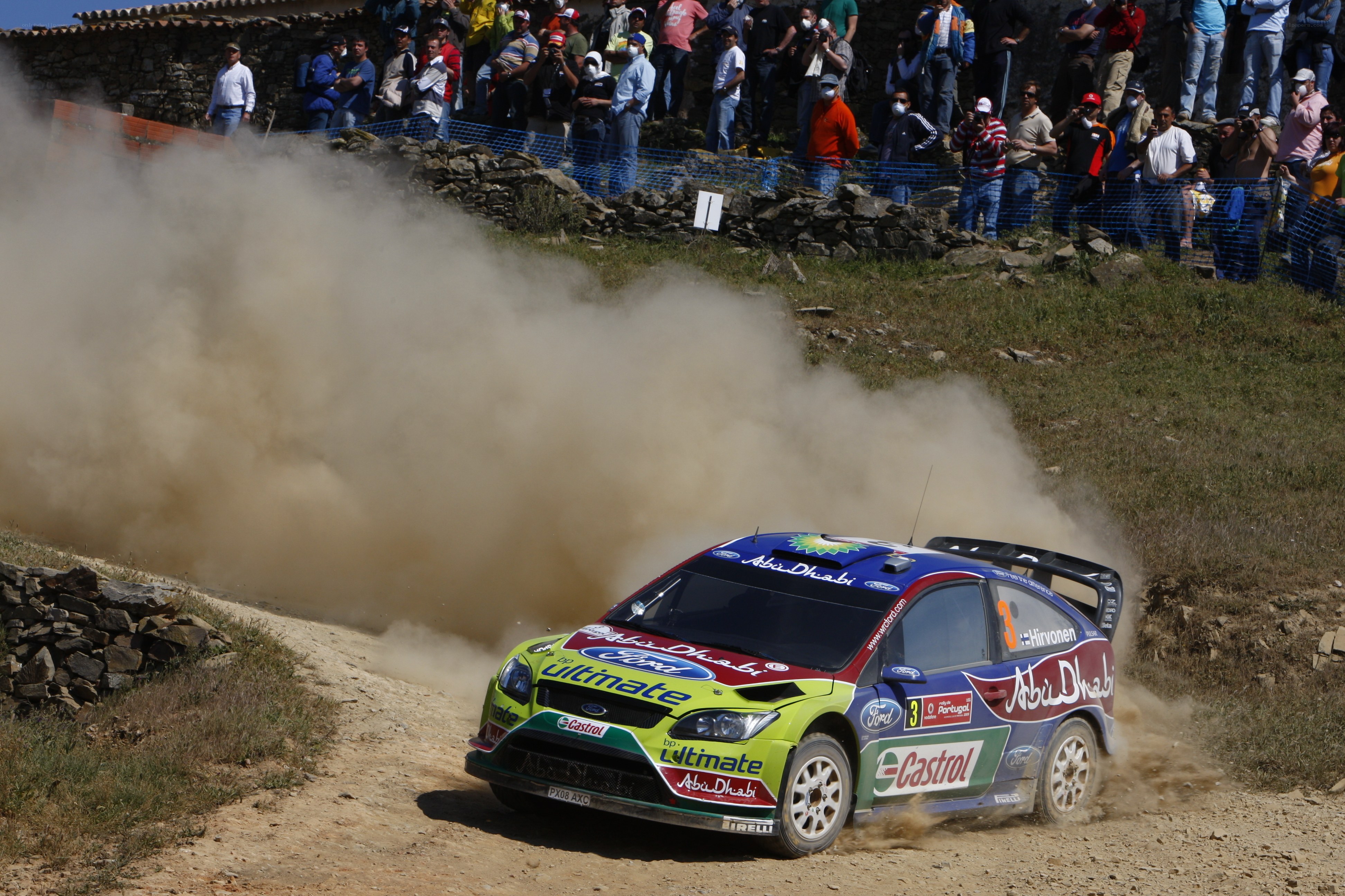 Rally car on dusty track