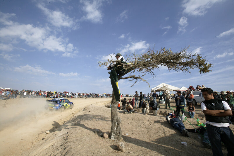 Rally car on dusty track
