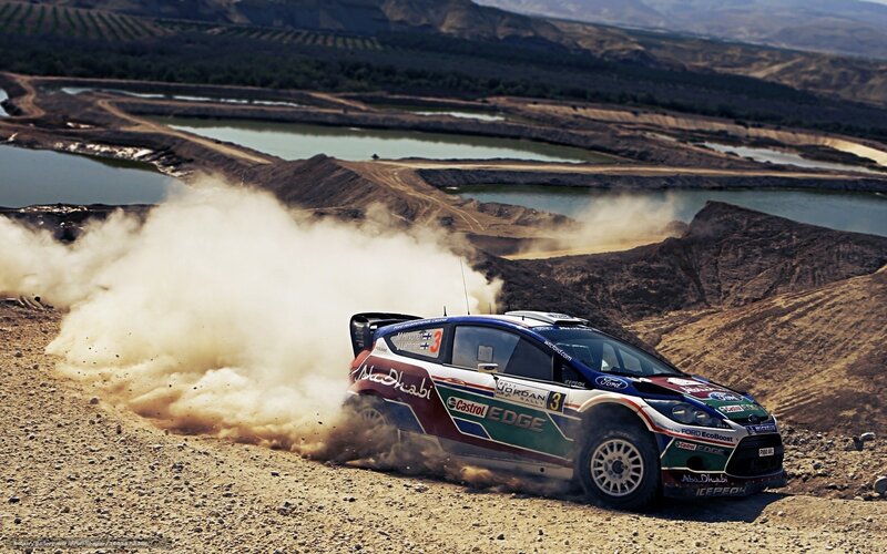 Rally car on dusty track
