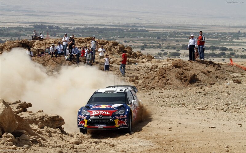 Rally car on dusty track