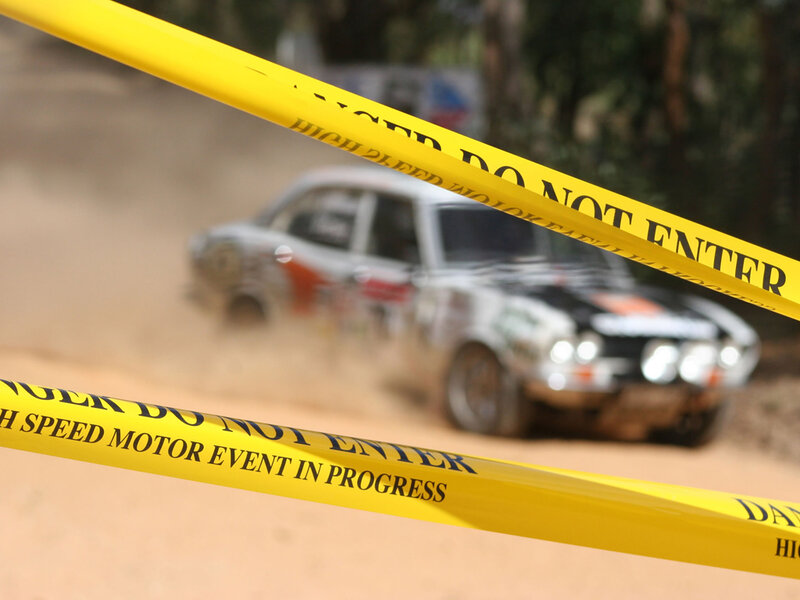 Rally car on dusty track