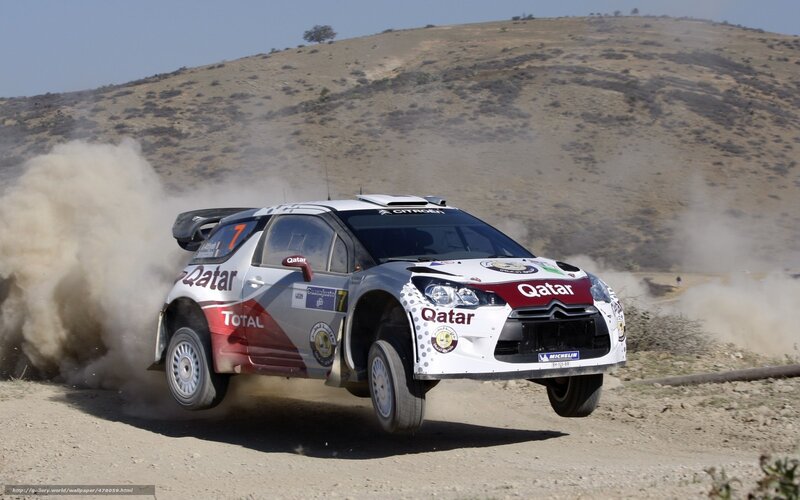 Rally car on dusty track