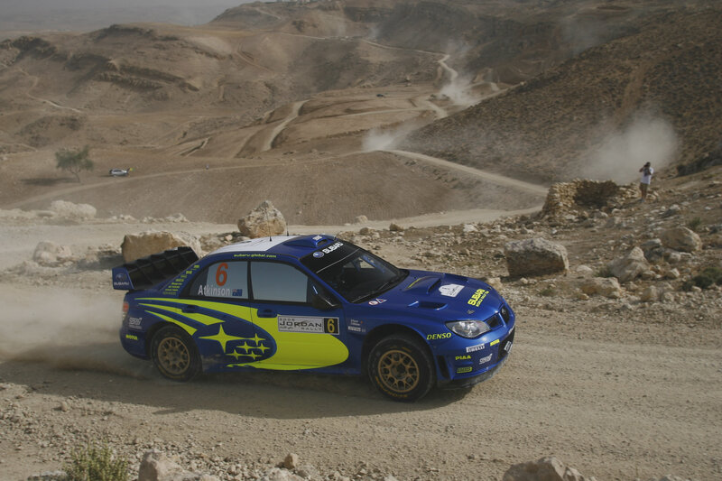 Rally car on dusty track