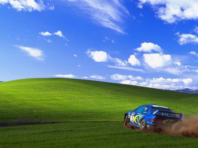 Rally car on green hill