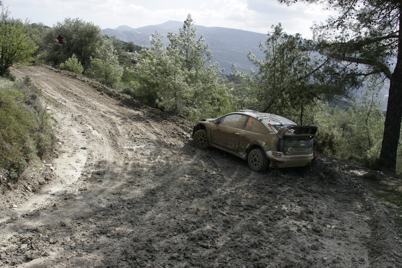 Rally car on muddy hill