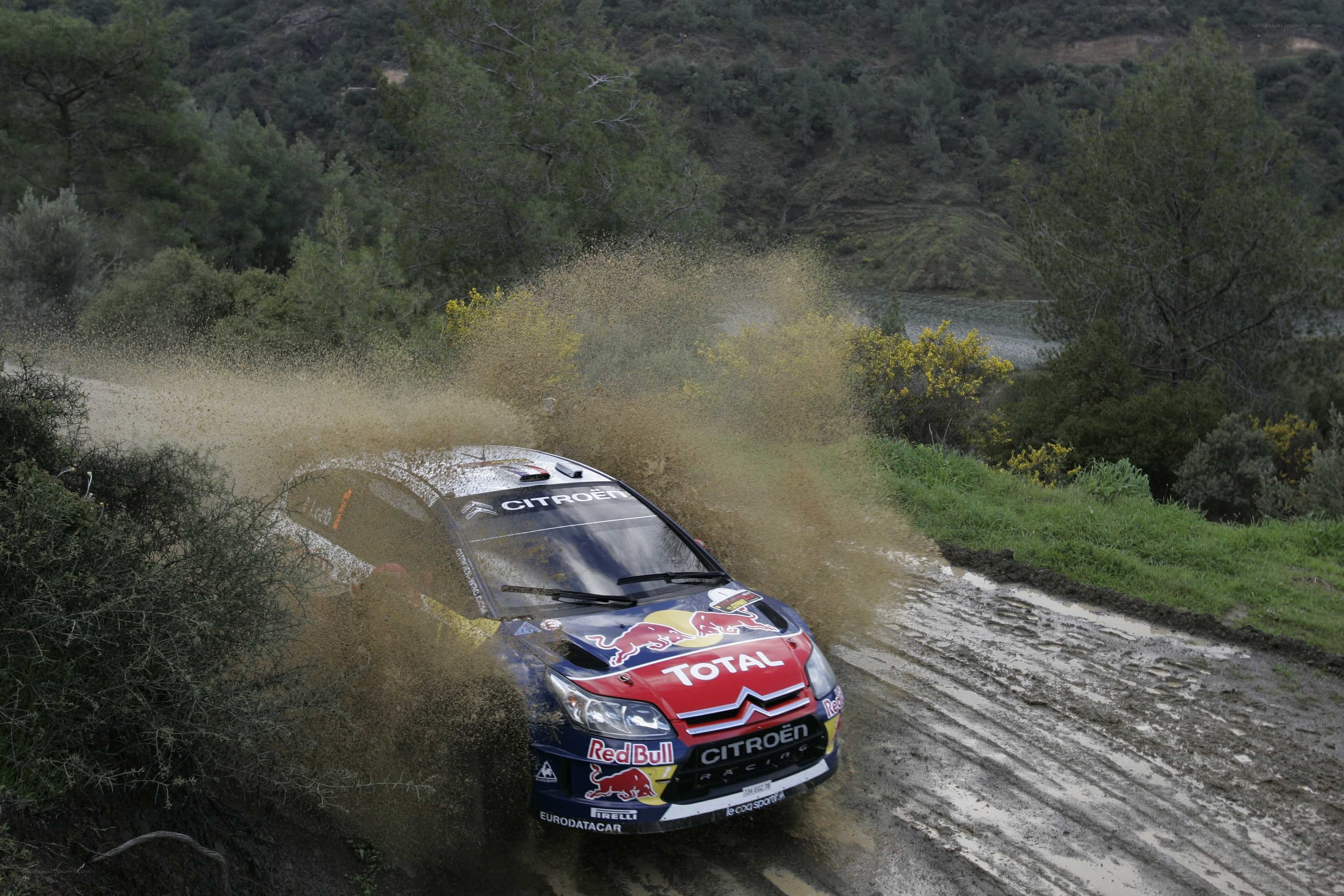 Rally car on muddy road