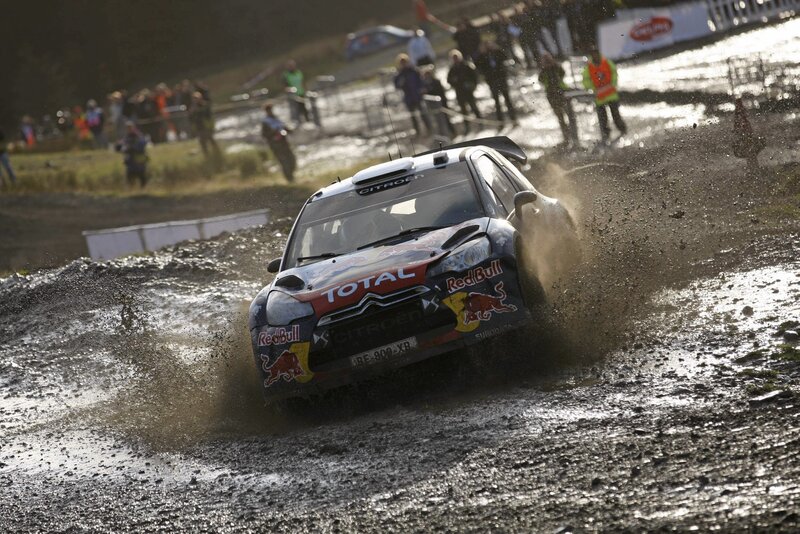 Rally car on muddy track