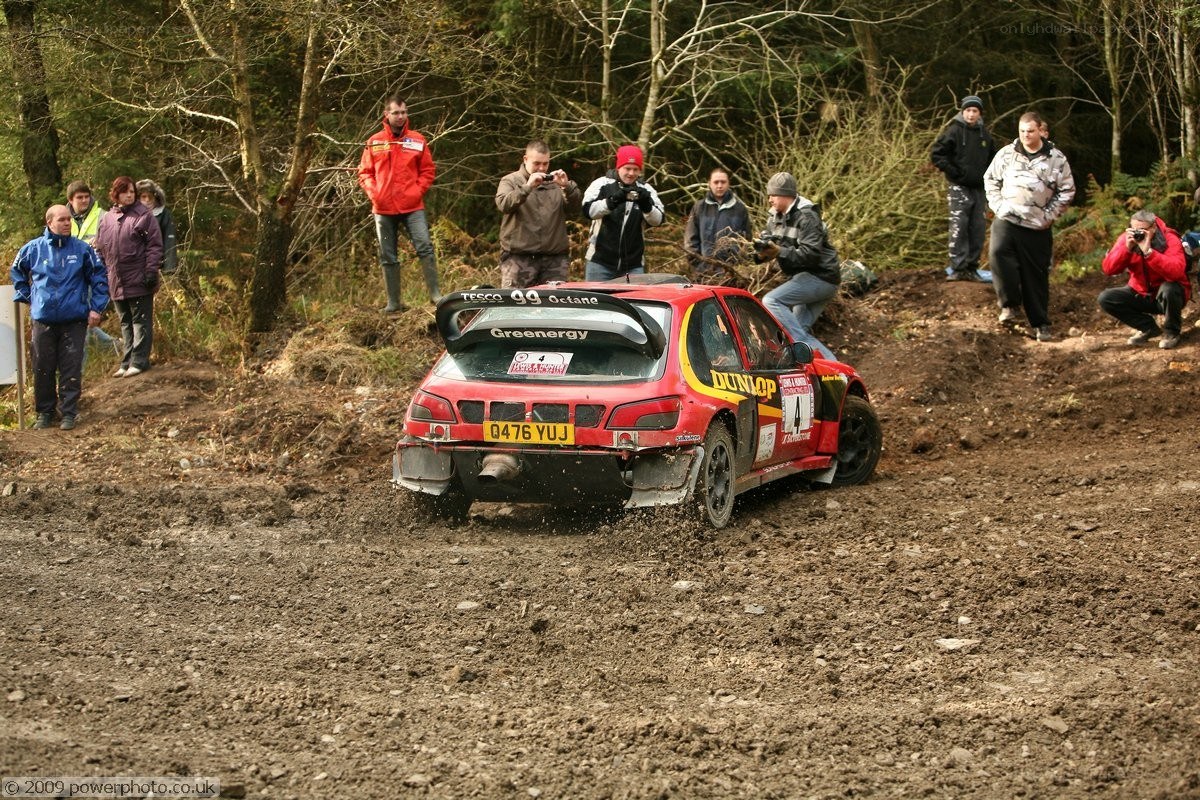 Rally car on muddy track