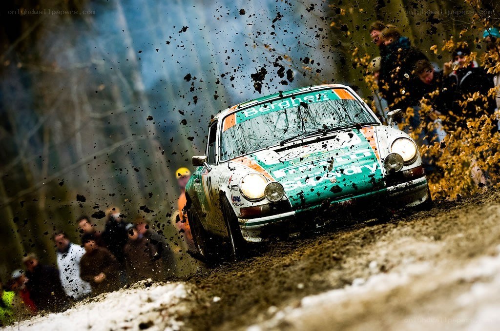Rally car on muddy track