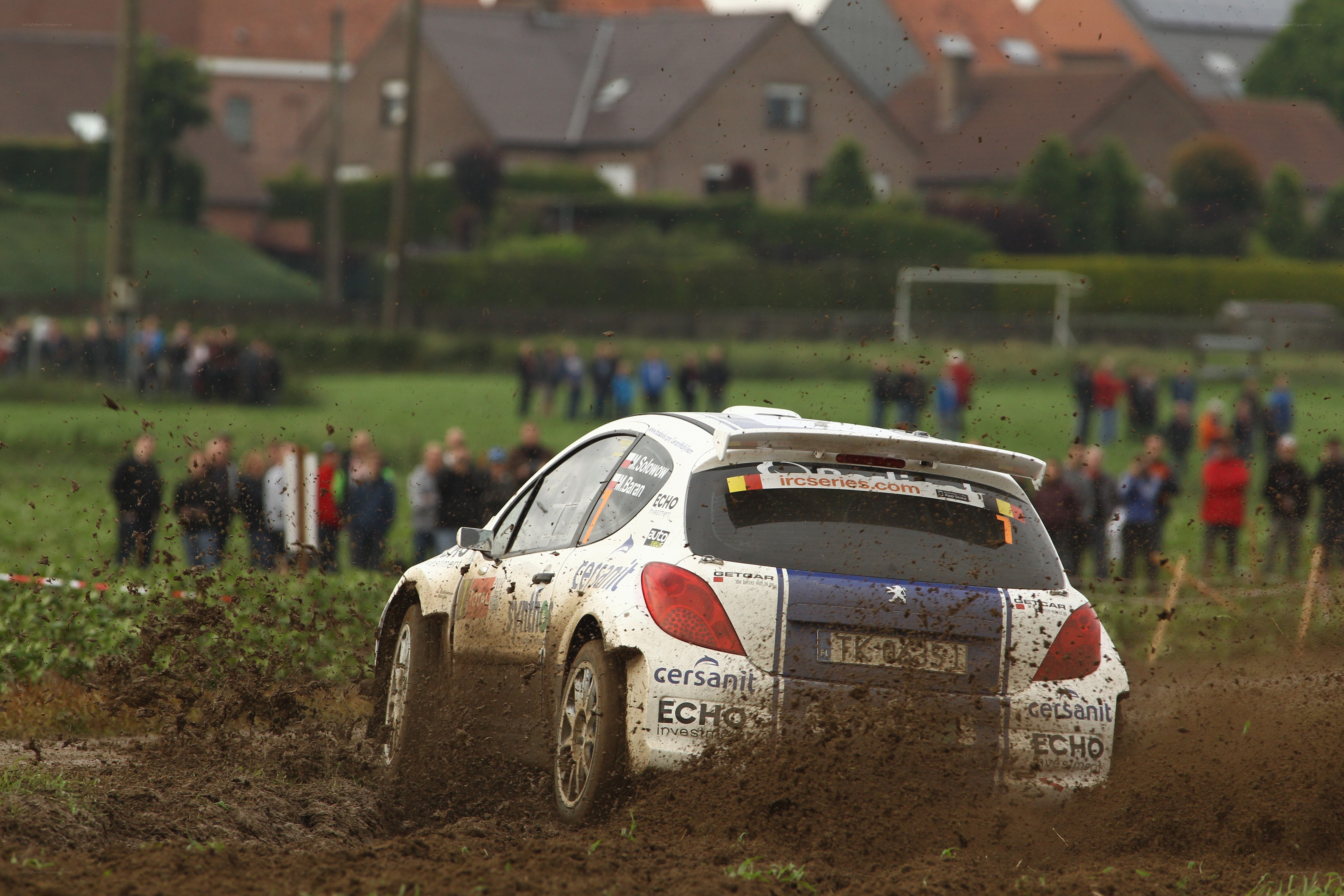 Rally car on muddy track