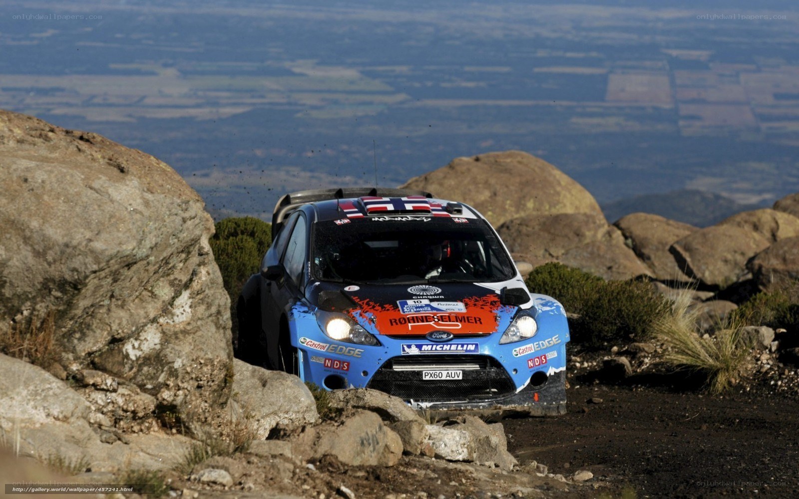 Rally car on rocky terrain