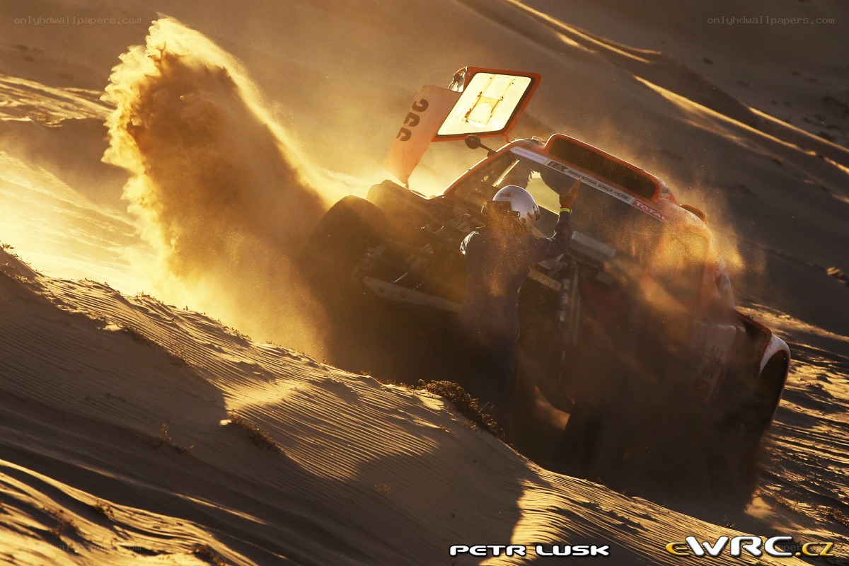 Rally car on sand dune