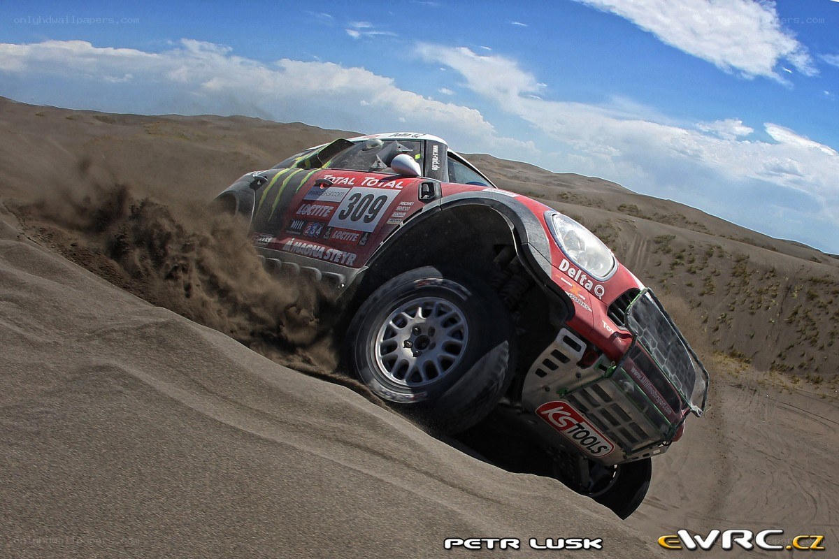 Rally car on sand dune