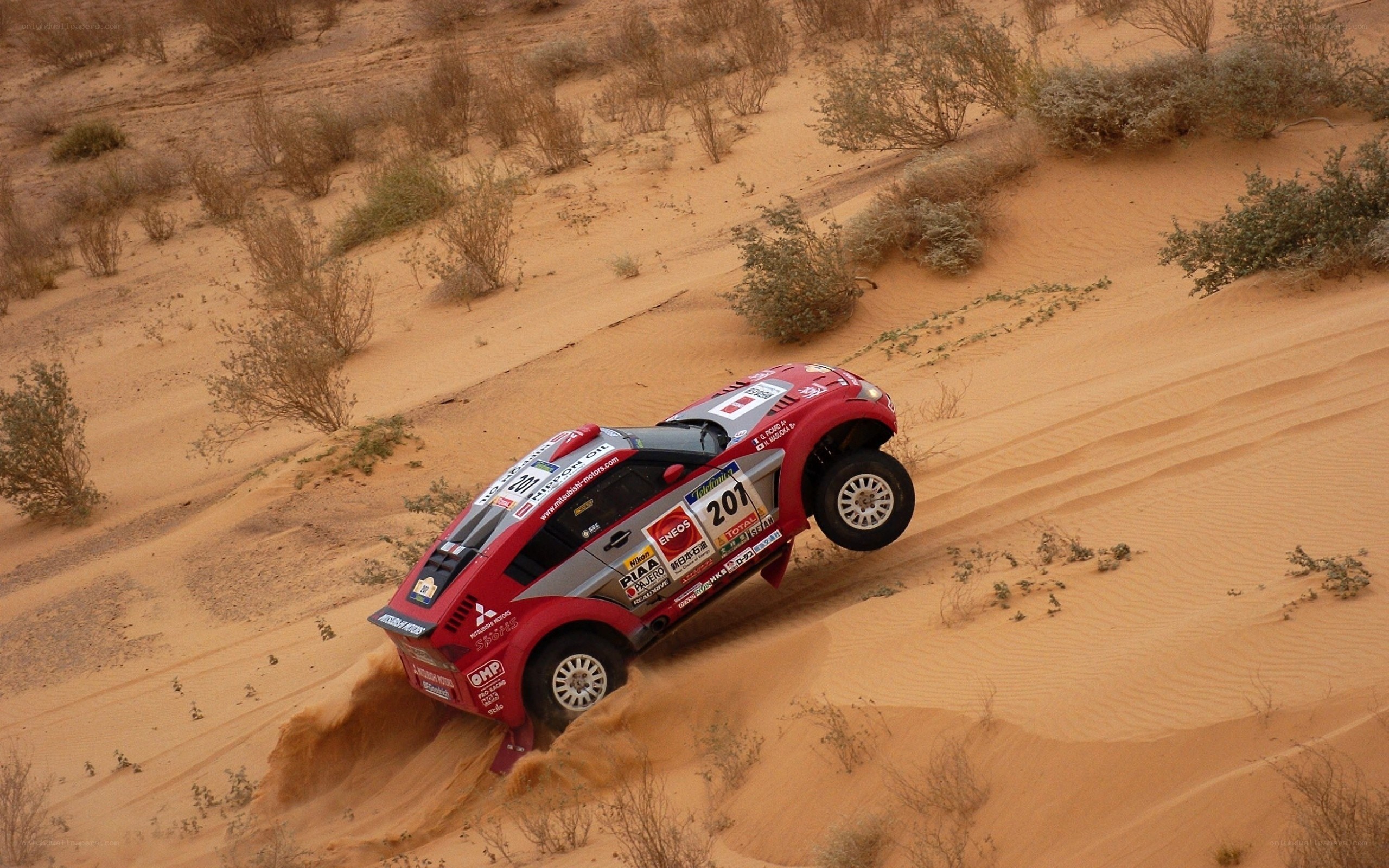 Rally car on sand dune