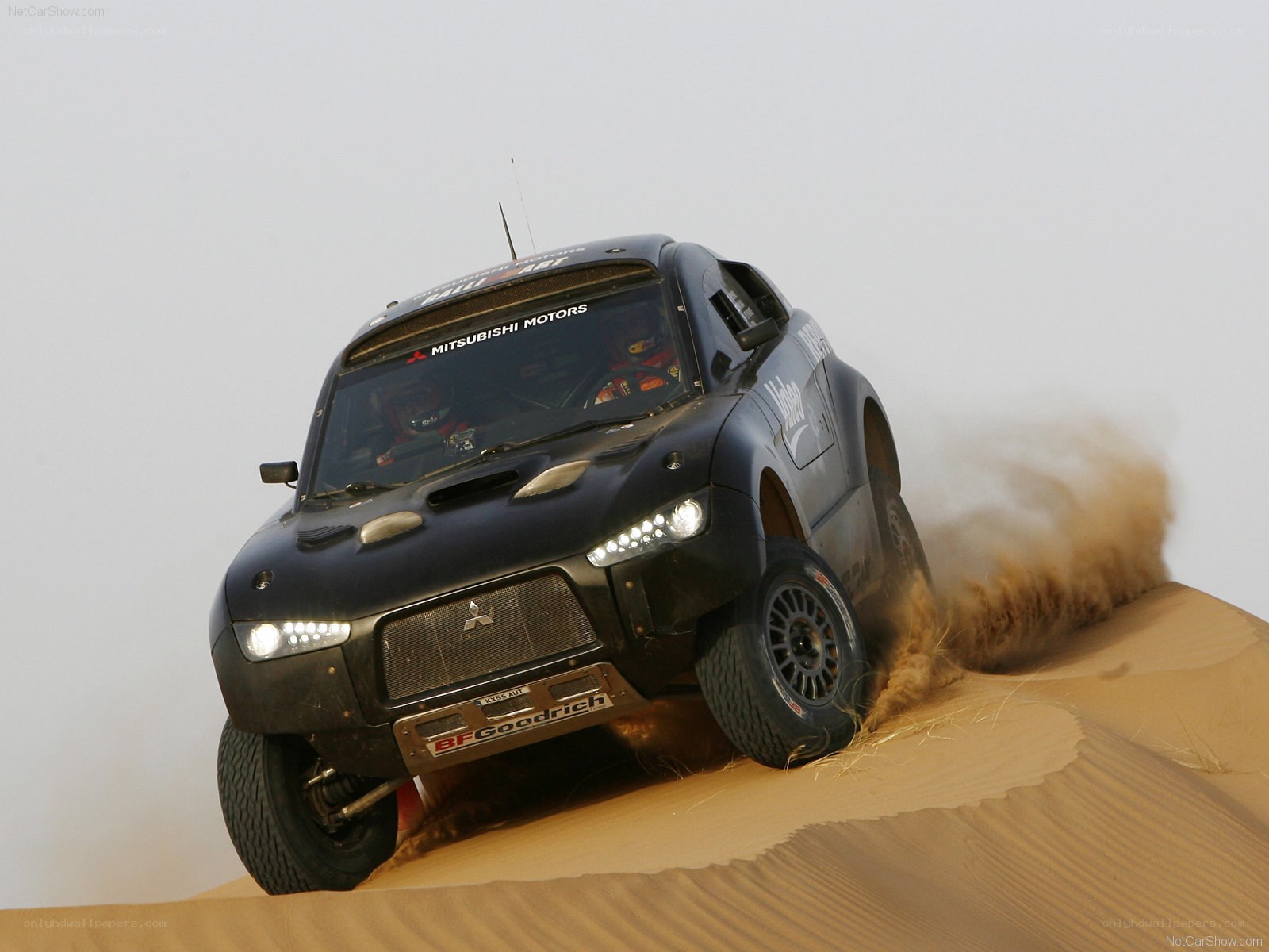 rally car on sand dune