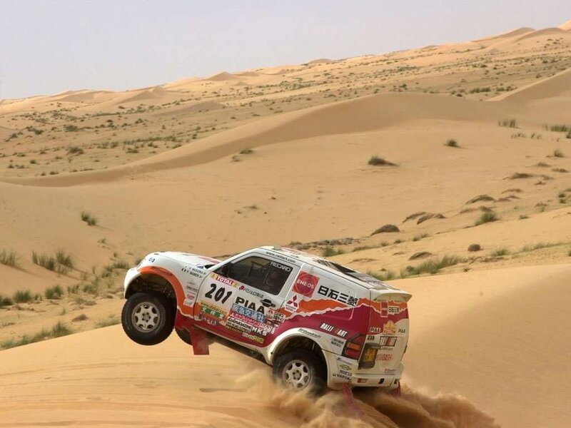 rally car on sand dune