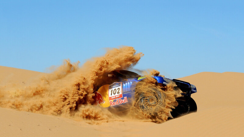 Rally car on sand dune
