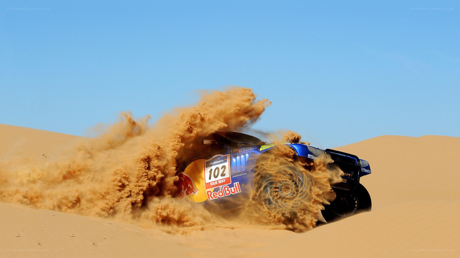 Rally car on sand dune
