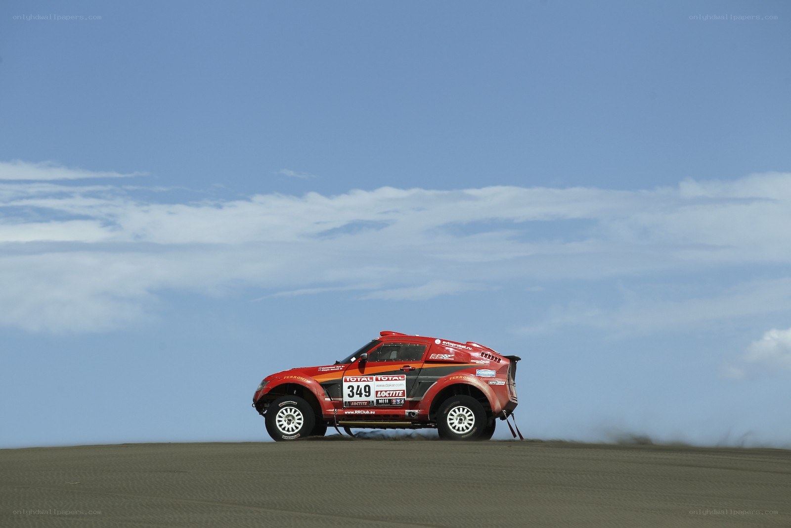 Rally car on sand dune