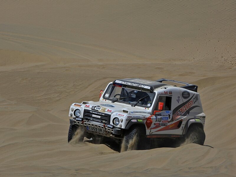 Rally Car on Sand Dune — White, Dynamic