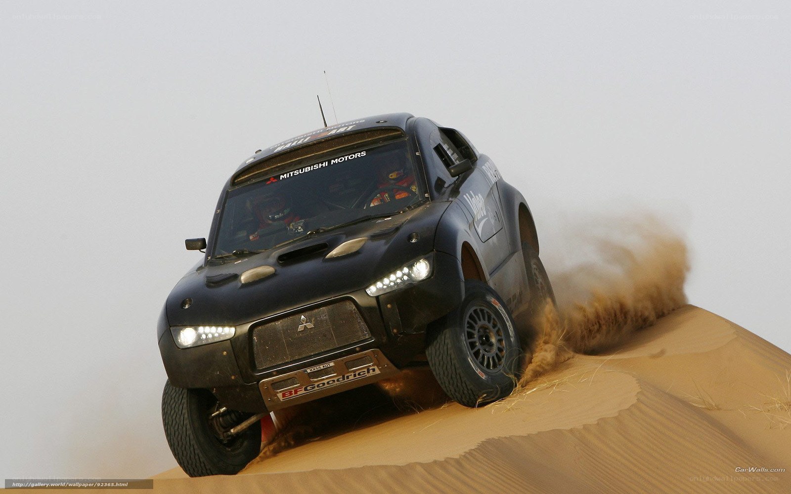 rally car on sand dune