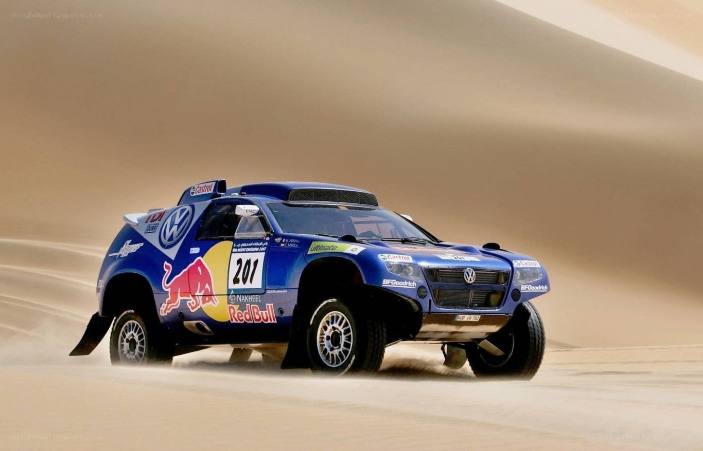 rally car on sand dunes