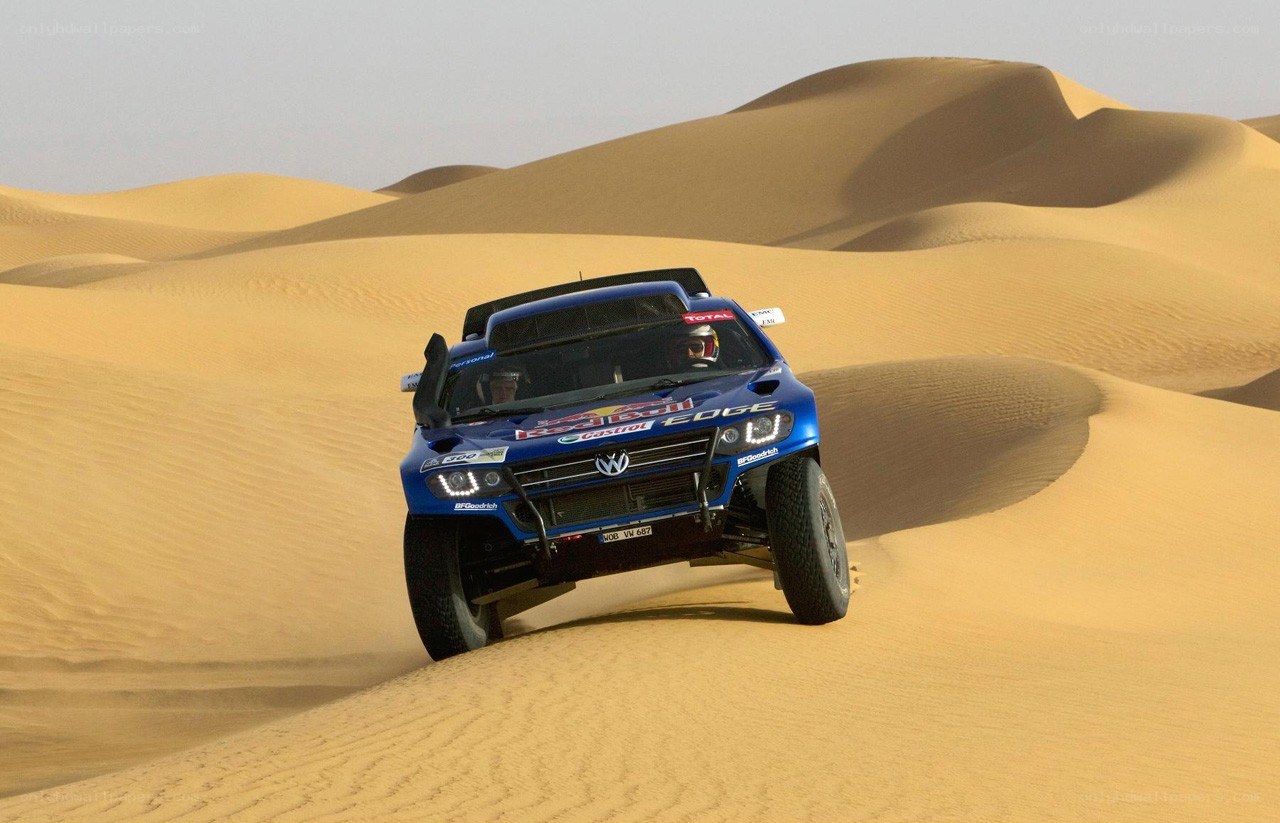 rally car on sand dunes