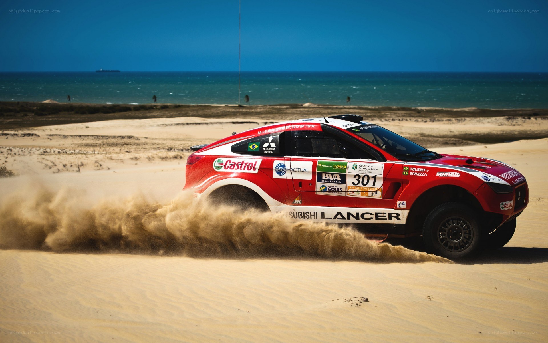 Rally car on sandy beach