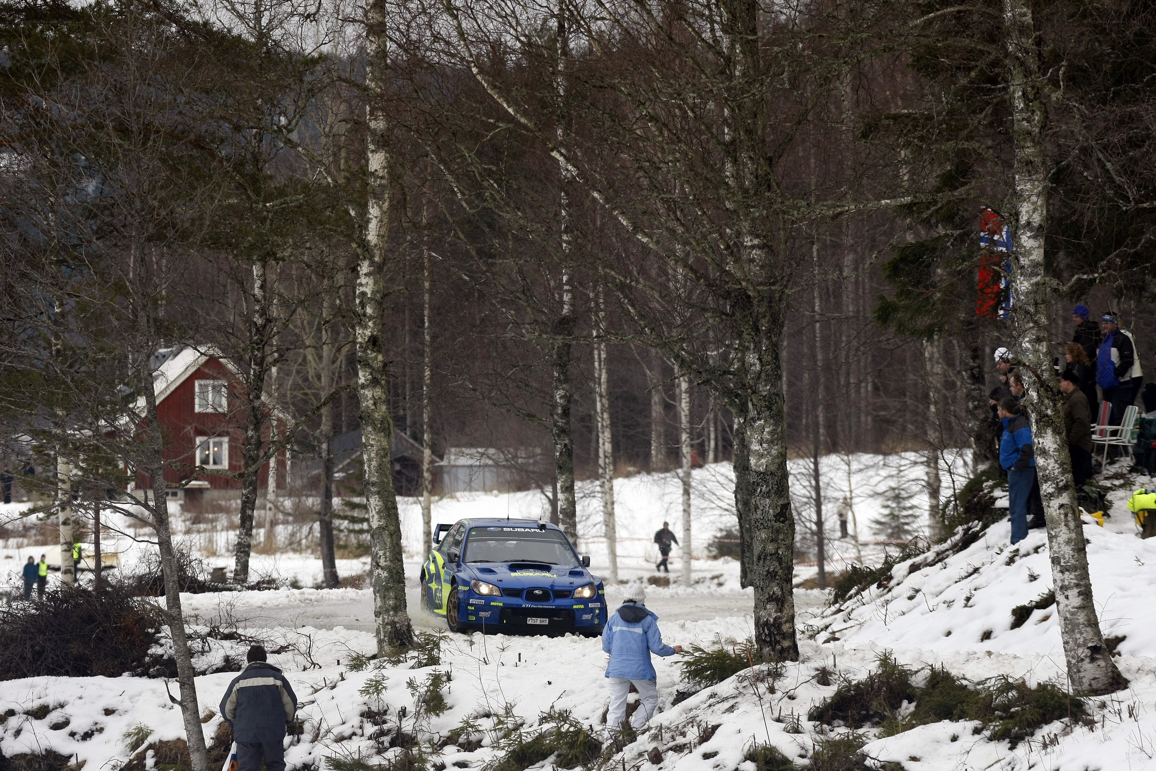 Rally car on snowy forest road