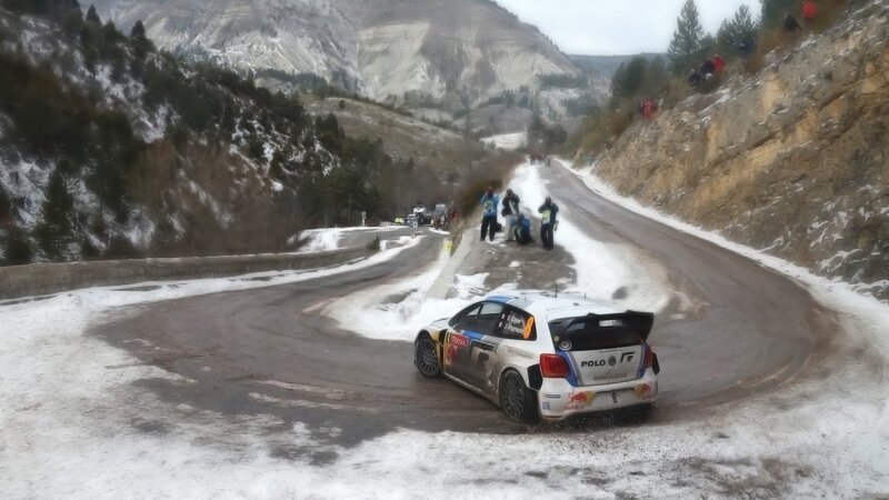 Rally car on snowy mountain road