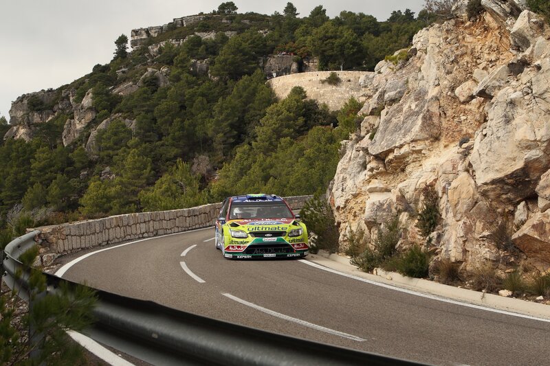 Rally car on winding mountain road