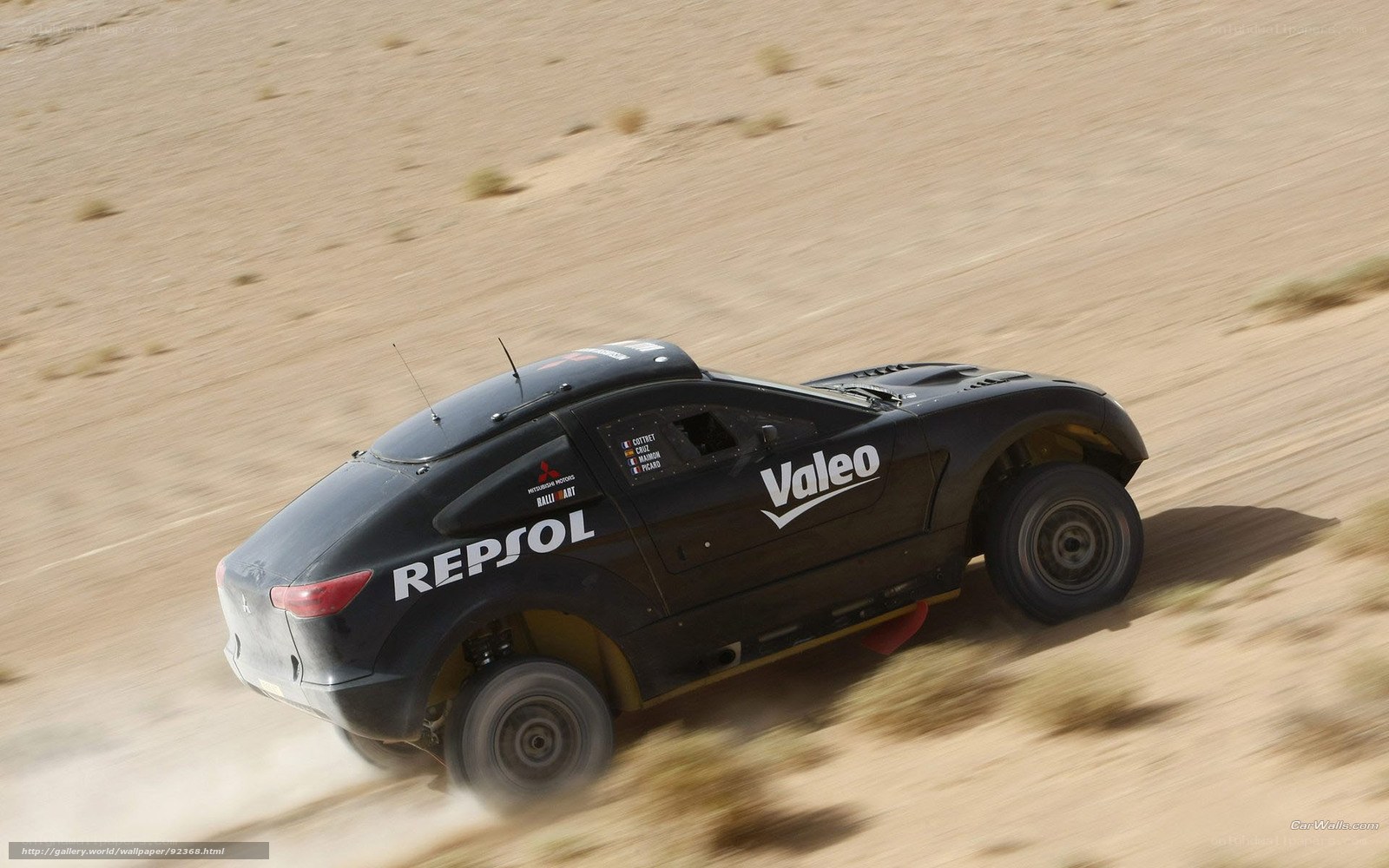 Rally car racing in desert