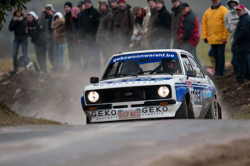 Rally car racing on a dirt track