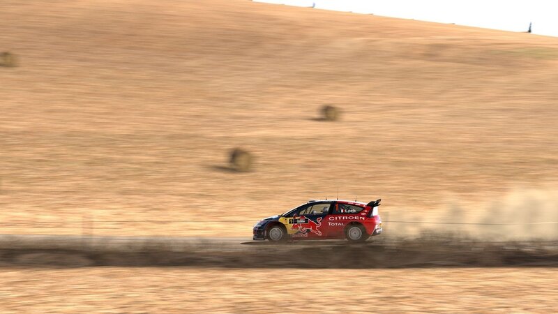 Rally car racing on dirt
